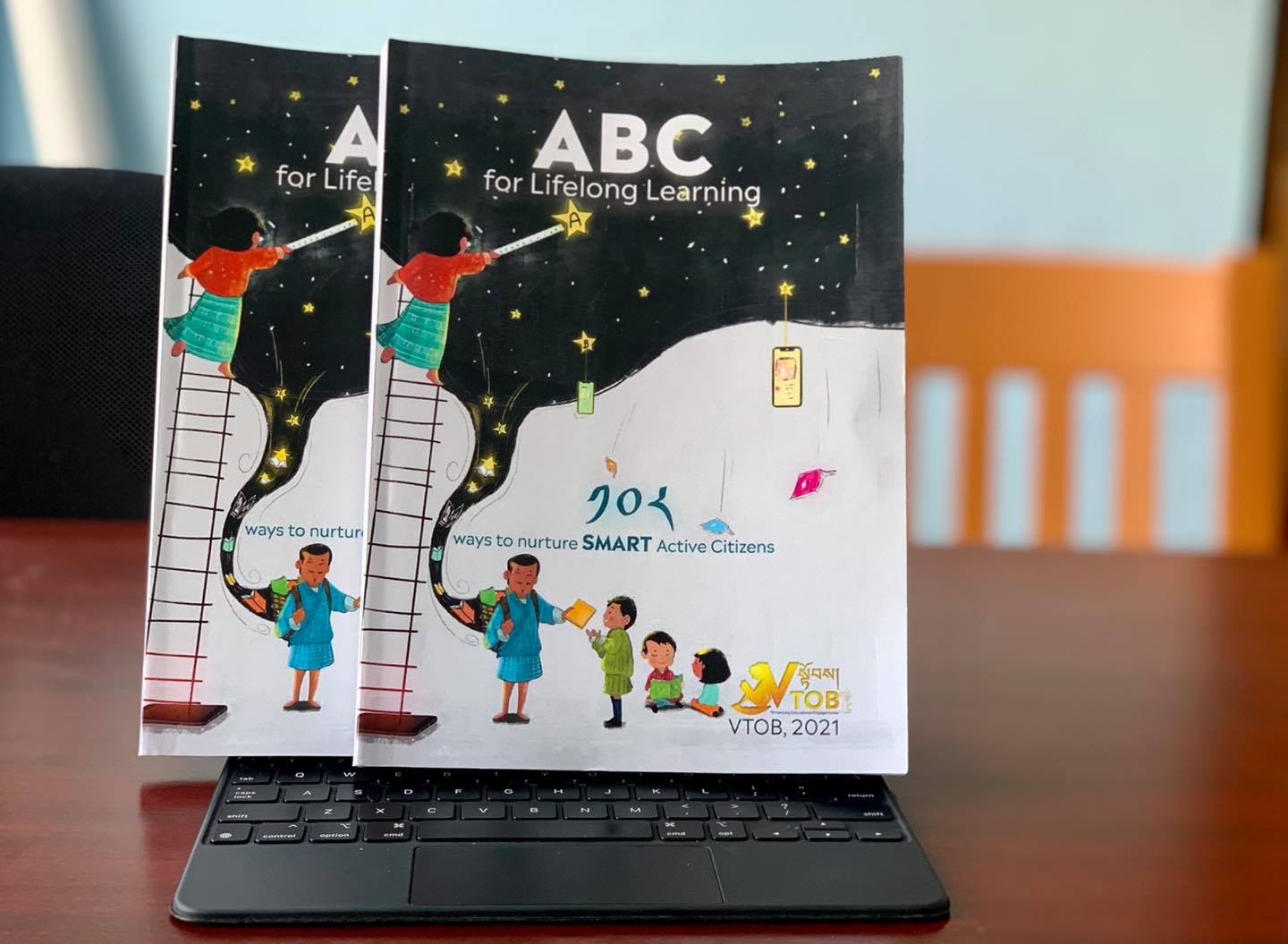 11.11.2021: We are excited and enthralled to launch our small book of big dreams- ABC for Lifelong Learning, 108 ways to nurture SMART active citizens. Mr. Rinzin Dorji, a lifelong educationist, did the honors of the launch. Mr. Rinzin became a teacher when he was just 16 and was also amongst the first batch of Head Masters in Bhutan. He is also a pioneer of private schools in Bhutan with his establishment of Rigsar School 3 decades back. VTOB is happy to have Mr. Rinzin grace this occasion and we offer our gratitude in the form of prayers for his good health and long life.
ABC for LifelongLearning is an activity book that contains 108 activities beyond the classrooms to nurture active citizens. It is written and published by the Team Members of VTOB. Thank you all for being your best.