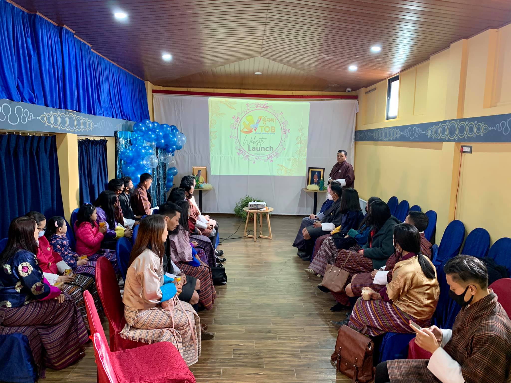 𝗩-𝗧𝗢𝗕 𝗧𝗵𝘂𝘀 𝗙𝗮𝗿 𝗮𝗻𝗱 𝗕𝗲𝘆𝗼𝗻𝗱
𝙒𝙚𝙡𝙘𝙤𝙢𝙚 𝙨𝙥𝙚𝙚𝙘𝙝 𝙖𝙩 𝙩𝙝𝙚 𝙑-𝙏𝙊𝘽 𝙬𝙚𝙗𝙨𝙞𝙩𝙚 𝙡𝙖𝙪𝙣𝙘𝙝
“Climb higher on the shoulders of past achievements- your task is not to fill old shoes or follow a well-trodden path, but to forge a new road leading towards a brighter future.”
~His Majesty the Beloved King

Ladies and gentlemen, on behalf of V-TOB, I would like to welcome you all to the launch of our website. Thank you for coming. 

First of all, on the joyous occasion of the 113th National Day, we offer our humble prayers and wishes to our Beloved King and the Wangchuck dynasty. May Bhutan be ever glorious and peaceful. 
Happy National Day

V-TOB dreamt of a website and here we are today- gathered in excitement, like a small child waiting to unwrap his long wished gift. 
The website will be the official site for all initiatives undertaken by V-TOB, including 10 Pages a Day Reading Journey. We intend to streamline everything through this website. 

The main aim of the website (through V-TOB) is to promote solidarity to transform challenges into endless opportunities through voluntary initiatives to enhance, supplement and complement educational opportunities and experiences. 

V-TOB is purely a non profit and unofficial voluntary group by teachers across the nation. It was founded on the sole purpose of volunteering with “service beyond the self.” 

The initiative was blessed beyond words by His Majesty the King on 8th May 2020 through a Royal Audience to the Core Team of the initiative. The team presented the initiative and it’s way forward during the blessed occasion. His Majesty motivated the initiative by showering support for the way forward of the initiative and also commanding that the group should stay in tact, even after the pandemic and school closures. 

V-TOB has played a humble role in providing continued education during the pandemic through our BBS video lessons, Radio Lessons and Self Instructional Material development with the support from Prime Minister’s Office, Ministry of Education and relevant stakeholders. 

V-TOB has carried out two rounds of donations during the pandemic. We had the privilege to present Nu. 1.246 million to the covid fund through the Prime Minister’s Office on 12 March, 2020. It was an unforgettable honour to contribute Nu. 3.292 million to His Majesty’s Kidu Fund on the occasion of Teacher’s Day 2020. The amounts came from voluntary donations offered by CDEOs, DCDEOs, Principals, Vice Principals, Teachers and Non Teaching staff from across the nation. 

We also had the privilege to compose, sing and release a Teacher’s Day tribute to His Majesty the King whilst celebrating the 2020 teacher’s day which was dedicated to our beloved king with the theme #MyKingMyGreatestTeacher on May 2, 2020. 

V-TOB tried our best to engage our children meaningfully during the pandemic through numerous online initiatives. We were invited as a social media influencer by the Prime Minister’s Office to pass information, create awareness and spread positivity during the pandemic. Reading was motivated and pushed like never before. The 10 pages a day reading journey, a reading initiative in partnership with Drukyul’s Literature Festival is a nation wide reading sensation.  We have 4500 plus registered readers and 11 Free Open Libraries across Bhutan. 

The #KadrinchheGyaLyonBangSum national drive to offer our gratitude and support to our beloved King, government, frontliners and Bhutanese in general saw a huge wave of solidarity from Bhutanese across Bhutan and beyond. The birth of Drukyul Education Family on Facebook was an immediate off shoot of this drive. 

Furthermore, V-TOB dreams to sail forward by doing our best bit to come together and support better educational engagements for our children. 

It is also an informal platform for teachers to inspire teachers so that we have happy, creative, innovative, inspired and collaborative teaching professionals. 

As of now, we are consistently working on these initiatives - 10  Pages a Day Reading Journey, V-TOB བཤད་ཐོ། CONVERSATIONS, 5 Minutes of V-TOB YouTube Channel, Bhutan Children’s Reading and Writeshop, Research and Drukyul Education Family. 

The initiative has 4000 plus teachers on board as of December 2020. 

V-TOB is not at all separate entity. It is a positive force of positive change through positive initiatives, all on the principles of volunteerism.  

V-TOB is also open to collaboration.  

Lastly, we offer our heartfelt gratitude to honourable Prime Minister, Sherig Lyonpo, Dasho Secretary, Ministry of Education, Royal Education Council, BBS, Motithang HSS, Lungtenzampa MSS, and all stakeholders for the trust, support and inspiration. We are motivated to do more. 

On this special occasion, we would also like to thank all our colleagues for the solidarity and cooperation- let us continue to do more. 

We would like to Thank iBest Studios for the unwavering support since the beginning and especially in realizing the website dream. 

V-TOB is ever grateful to our supporters and well wishers for the continued inspiration and motivation. We would have loved to have you all here but we couldn’t, owing to the pandemic. 

Once more, we would like to thank everyone for your time today and we look forward to your continued guidance and support- kadrinche. 

Have a pleasant evening. 

Let us do more and together we can!

Palden Drukpa Gyelo

Sonam Norbu
Teacher, Lobesa LSS, Punakha