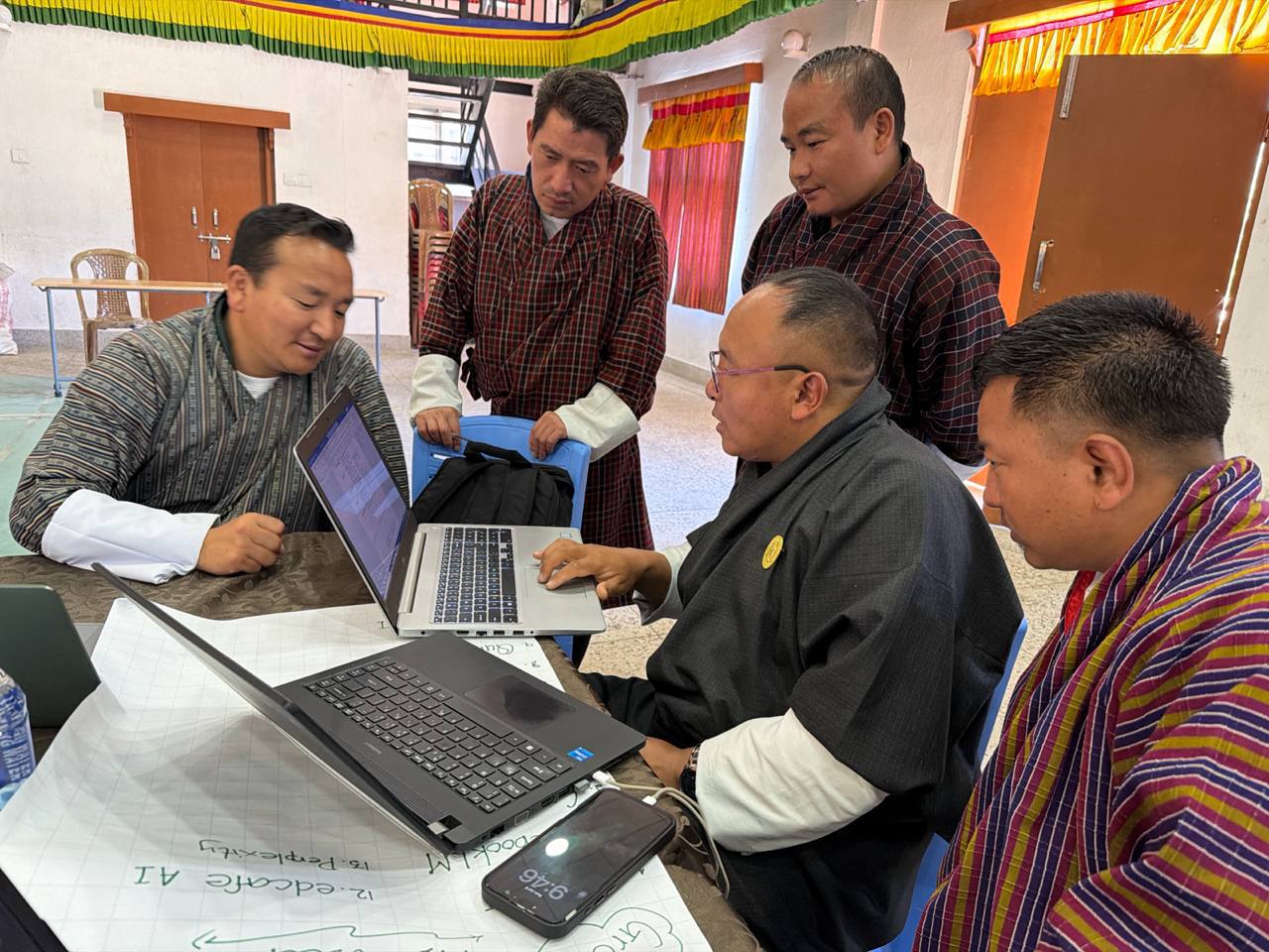 Participants collaborating in subject groups to design differentiated learning resources