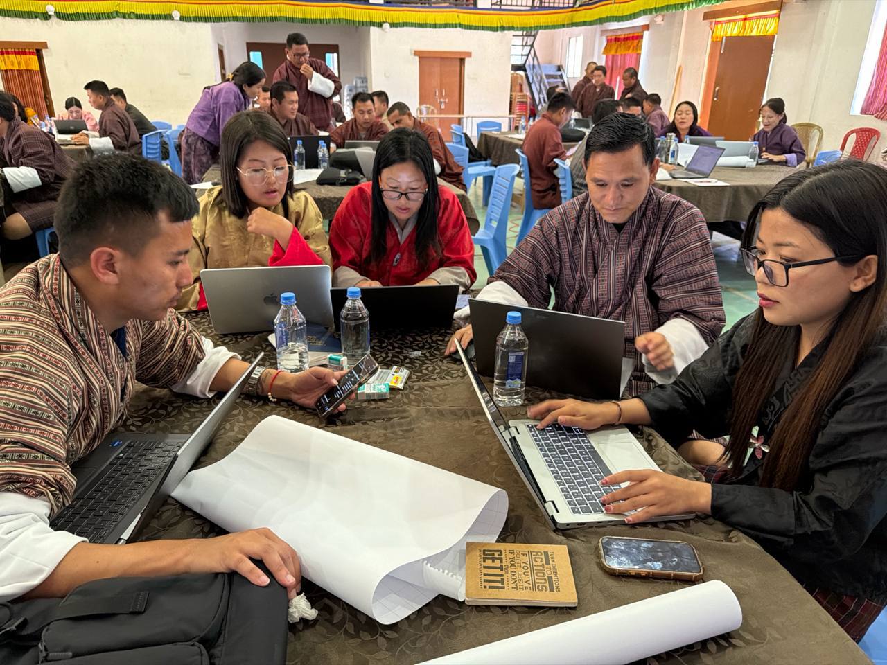 Teachers exploring AI tools in groups