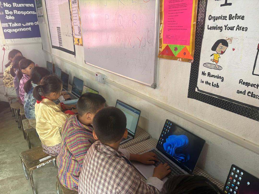 Students engaging in hands-on digital learning in the computer lab